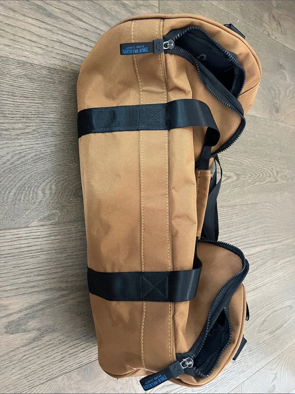 True Religion Tan Canvas Duffel with Black Straps